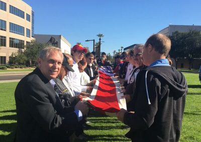 Dave Giles helping Fold USS Arizona Flag